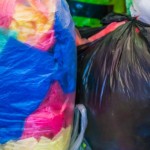 Collecting used colored plastic bags